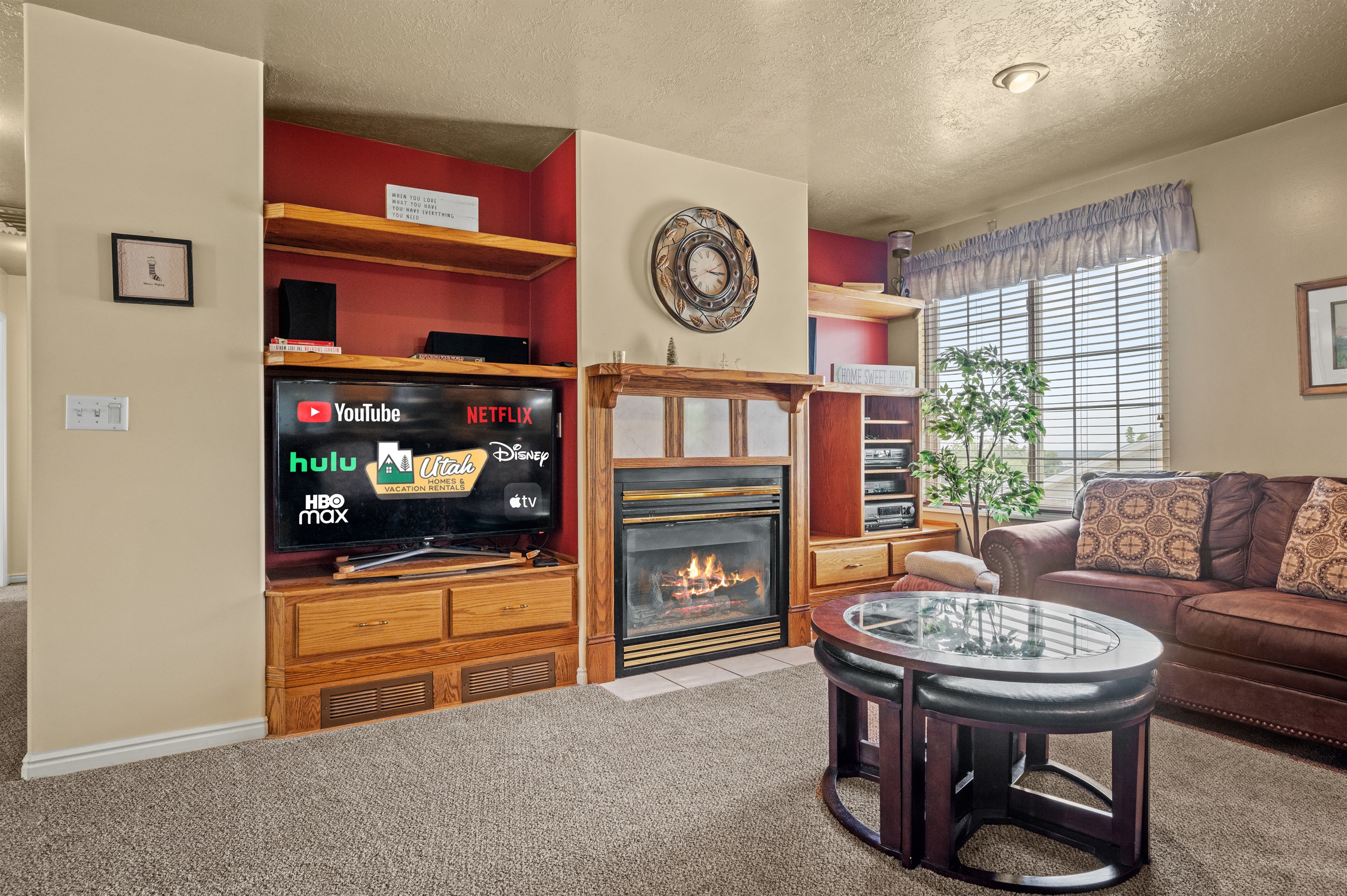 Rustic living room with smart TV and fireplace — perfect for relaxing after skiing.