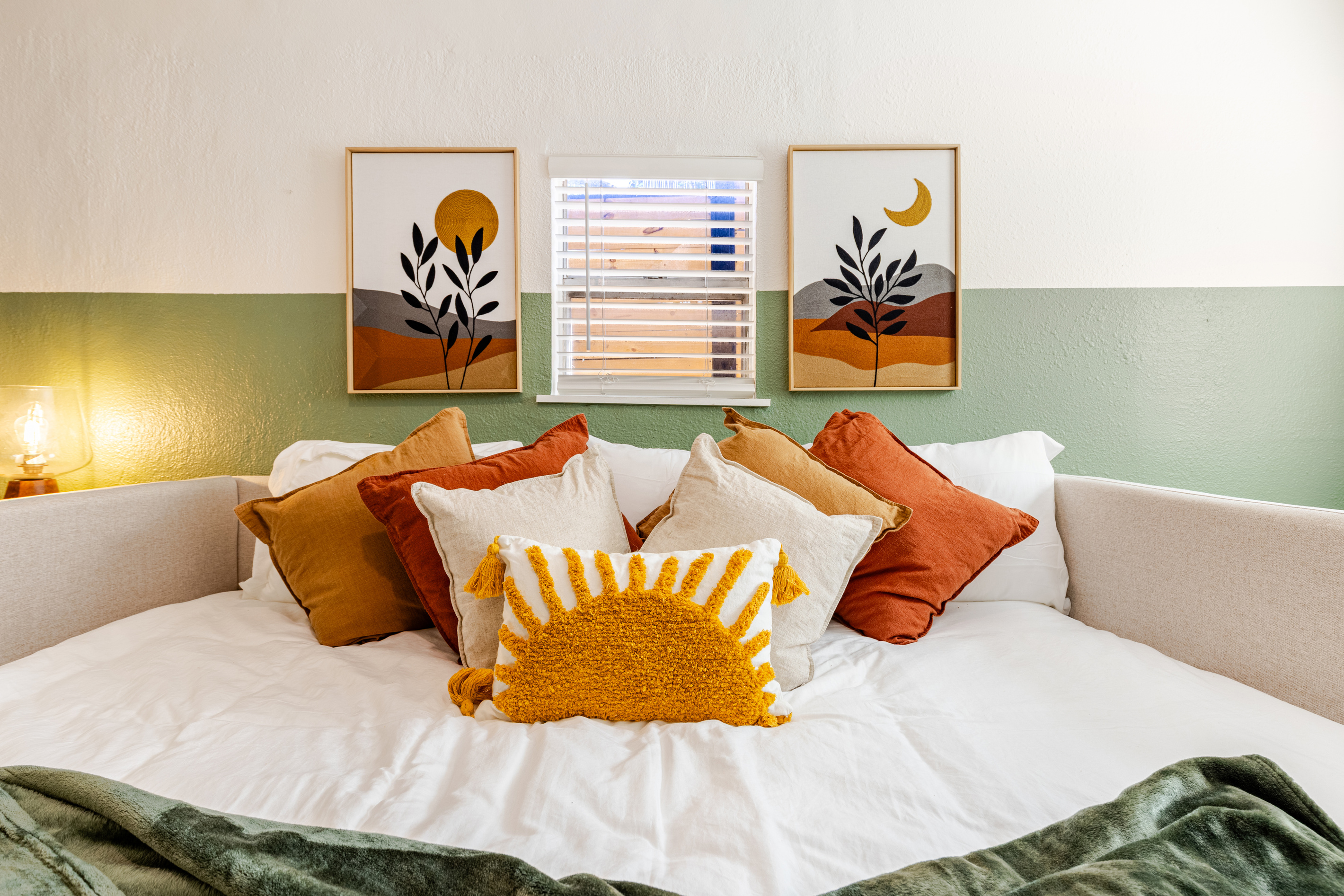 Bright, artful space with plush pillows and a warm, inviting ambiance!