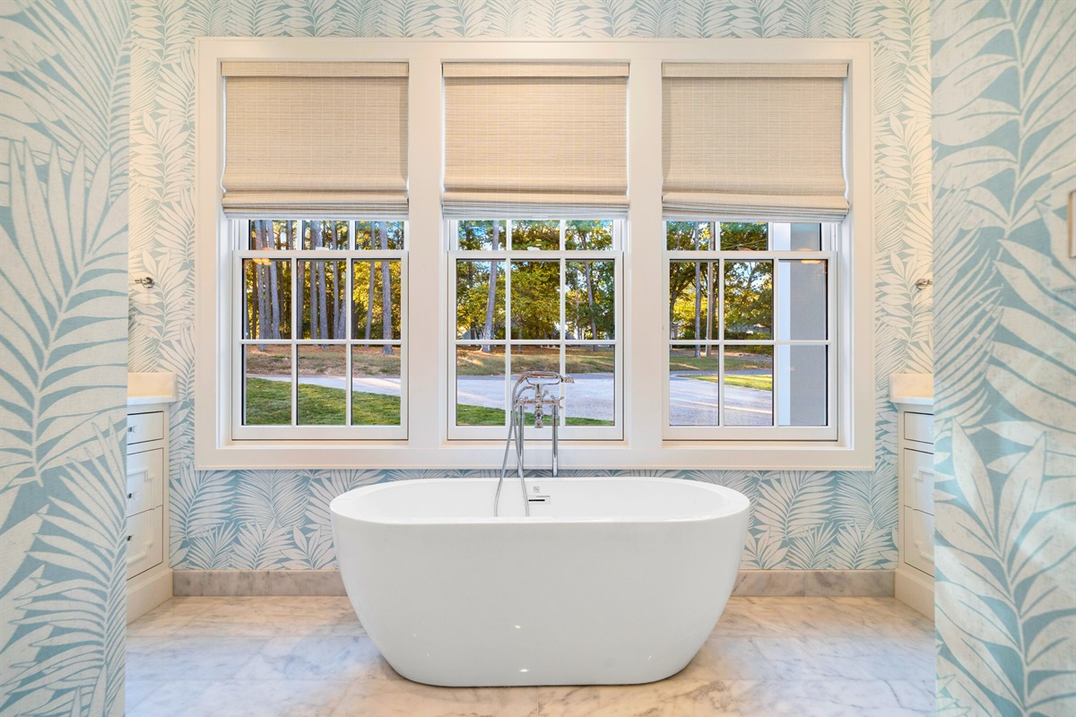 Freestanding soaking tub with serene views