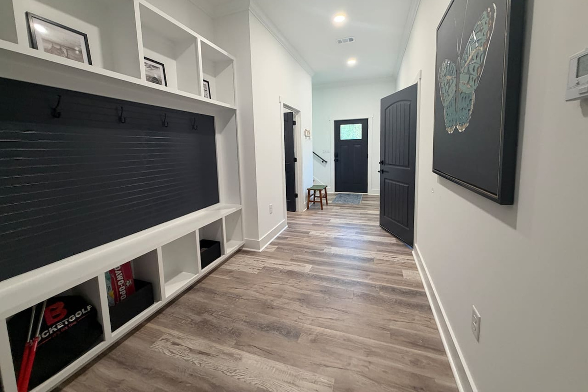 Entry way/mud room on first floor. Board games located under mud room bench. 