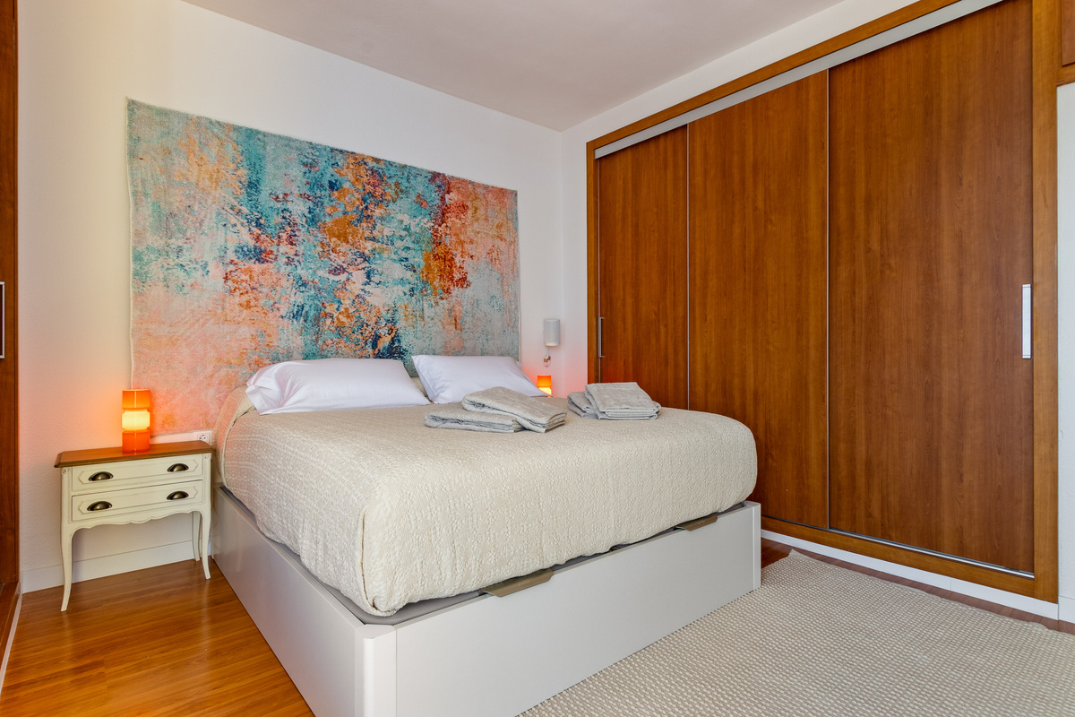 Comfortable bedroom with generous wardrobe storage.