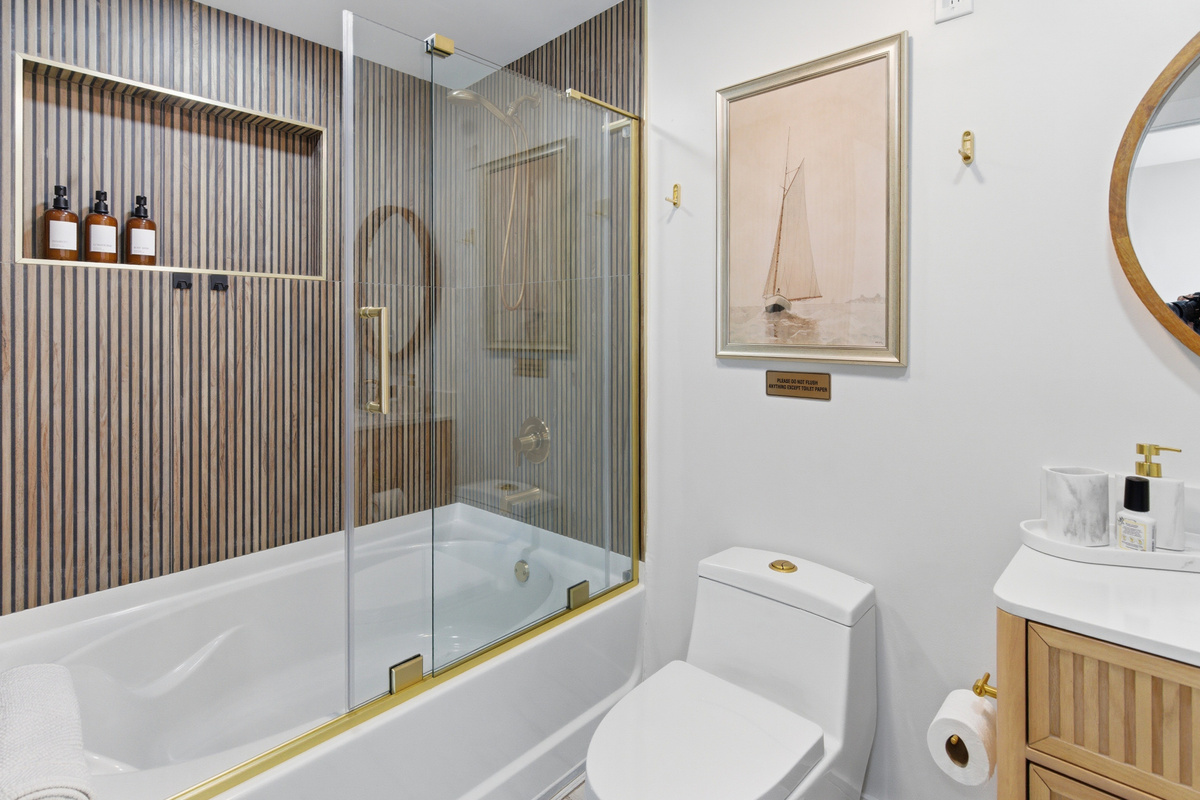 Large soaking tub is perfect for relaxing after a long day at the beach.