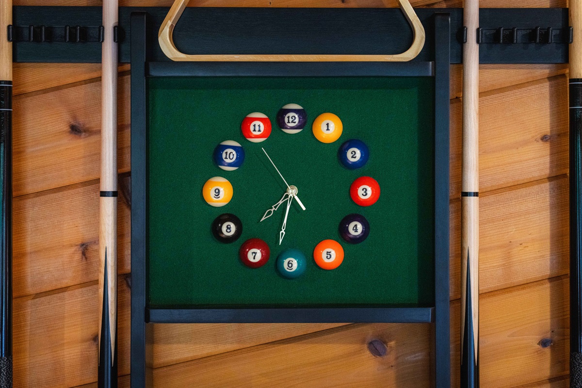 Custom details like the billiard ball clock add a playful touch to your stay.