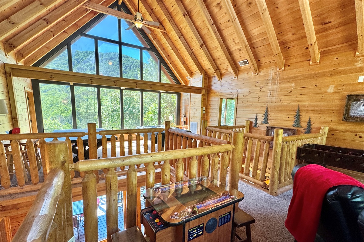 Soaring ceilings, and open to lower level. Video arcade!
