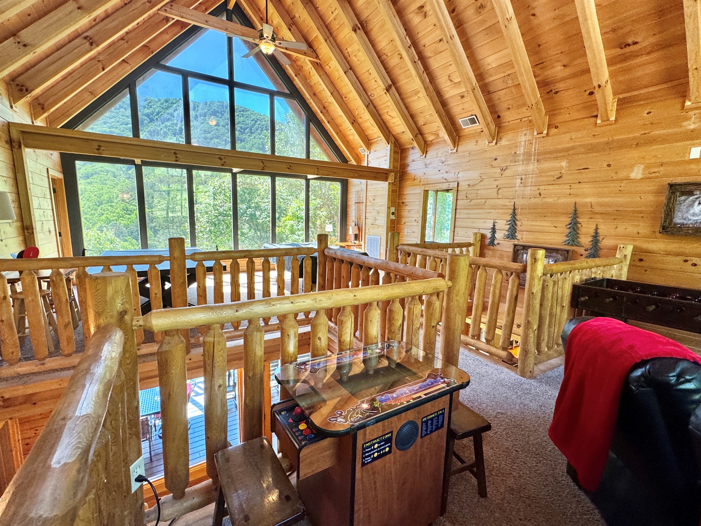 Soaring ceilings, and open to lower level. Video arcade!