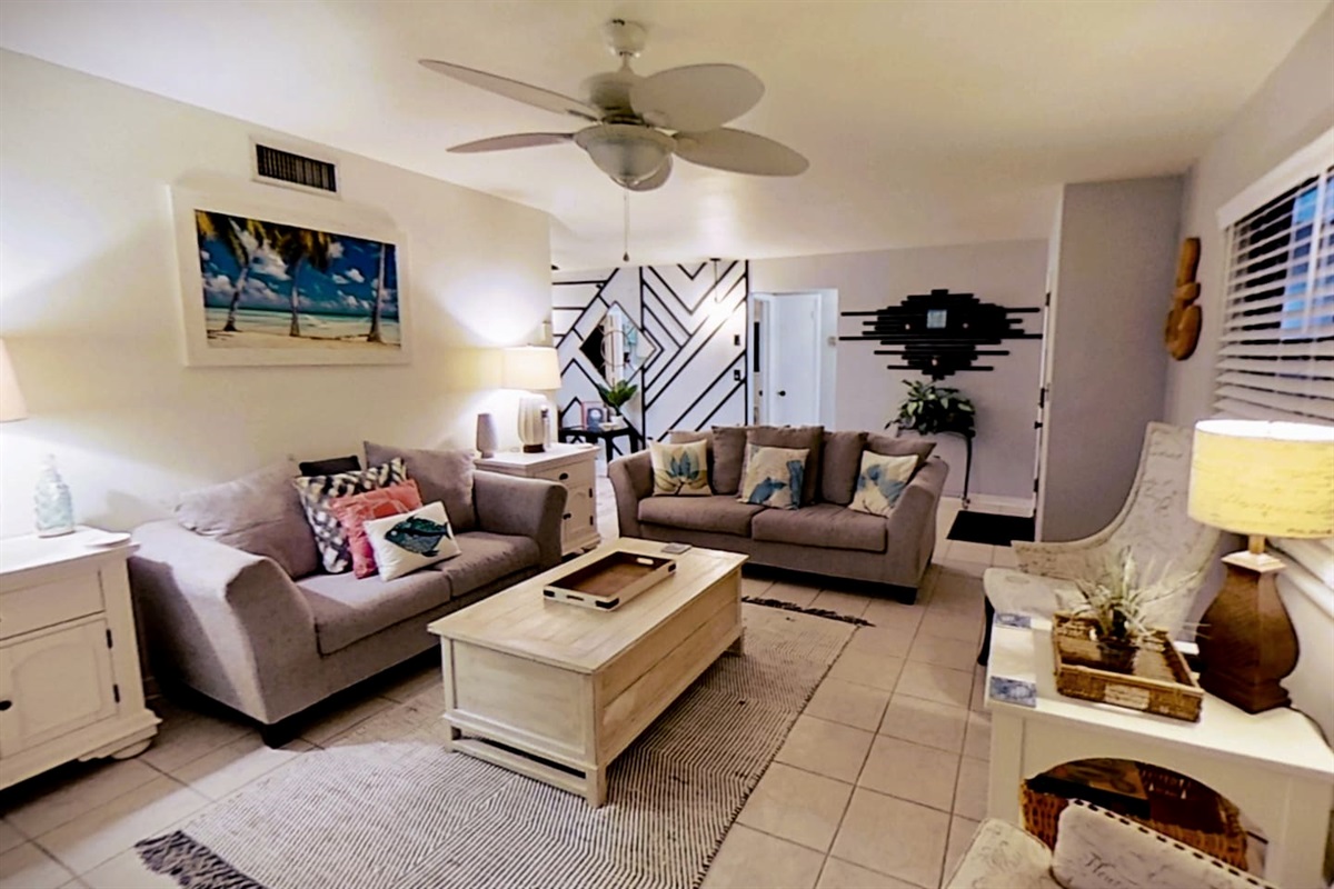 Living Room, clean & comfortable, with plenty of seating to spread out and relax, while enjoying the 65" smart tv
