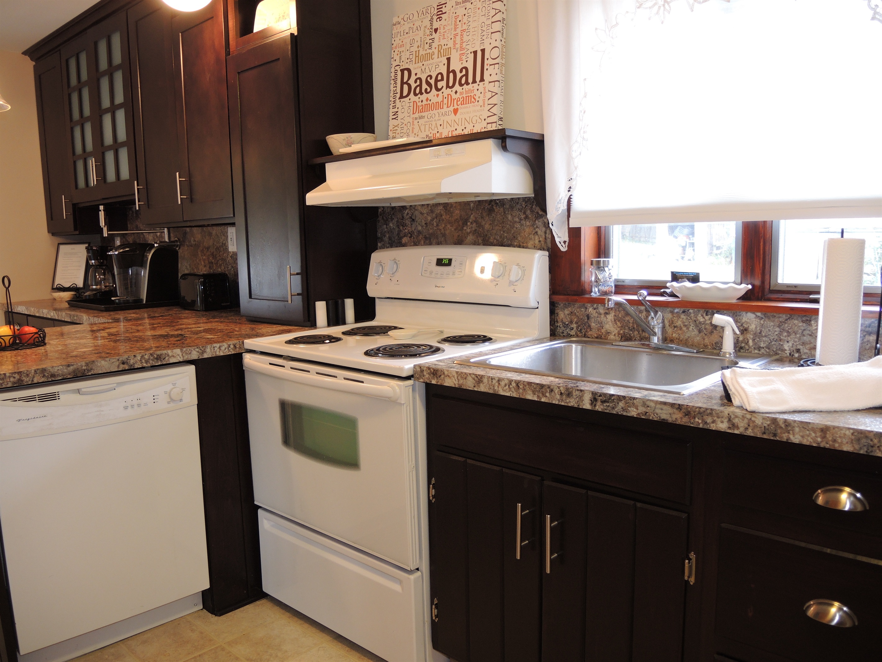 Kitchen is complete with a dishwasher.