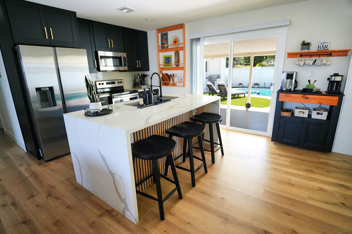 Enjoy a spacious, fully stocked kitchen, ample prep space, and a breakfast bar. Whether you're making a quick snack or a family meal, you'll find everything you need for a comfortable stay.