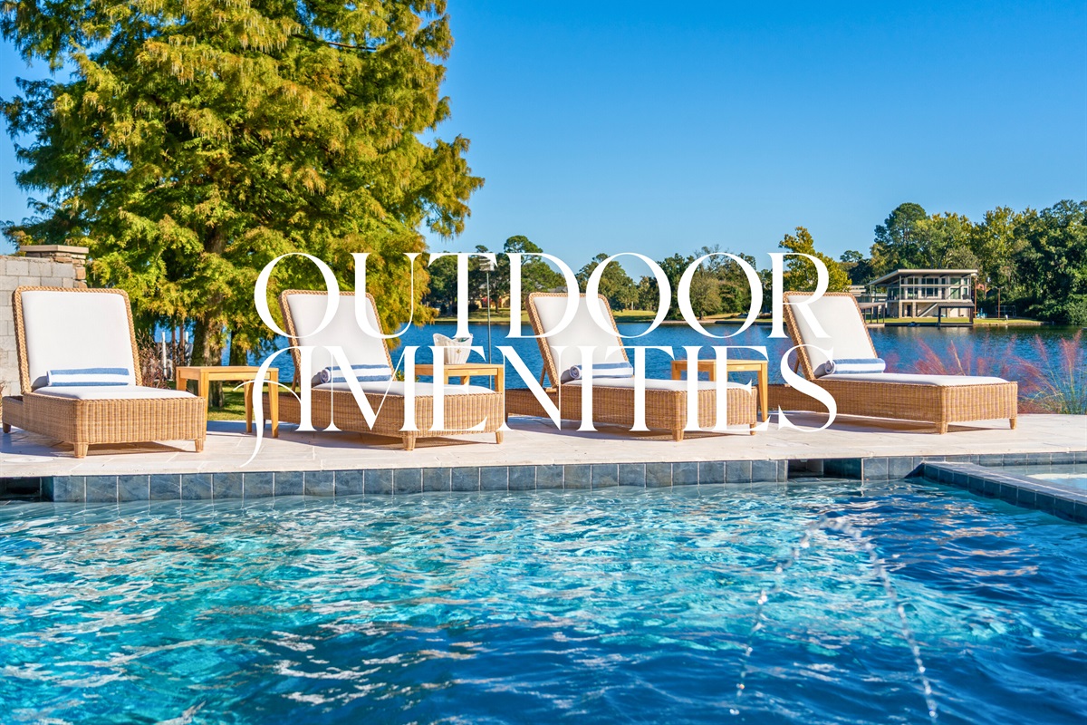 Infinity-edge pool overlooking the lake and tree-lined shore.