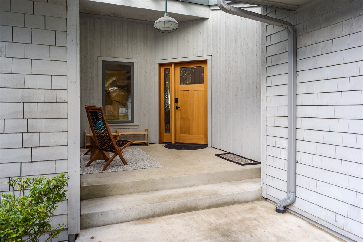 The front door is sheltered and a perfect place to sit outside and listen to the calming rain bounce on the rooftop or beat the heat of the sun while still enjoying the ocean scents. 