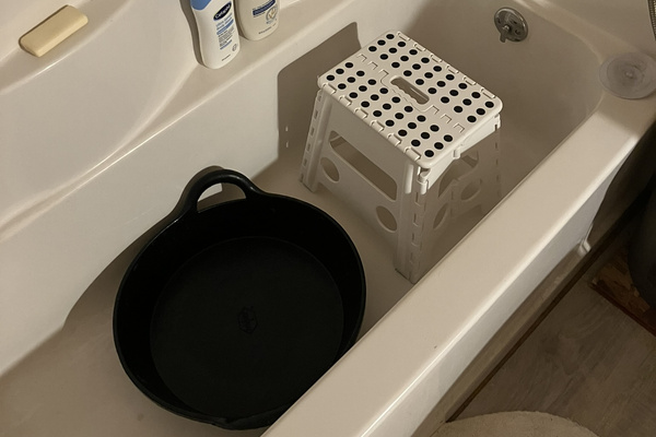 Foot washing station in the tub.