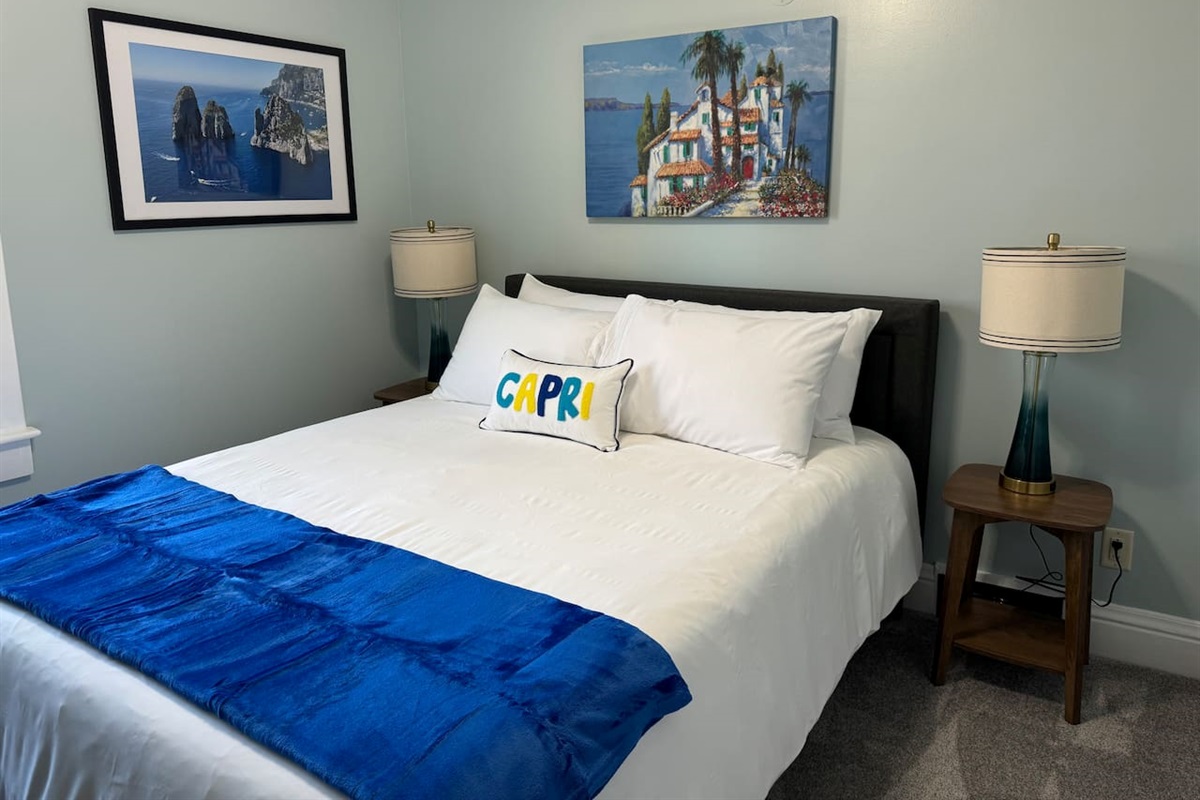 The Upper Level Capri Room offers Queen bed and Roku smart TV in a calm and relaxing setting.