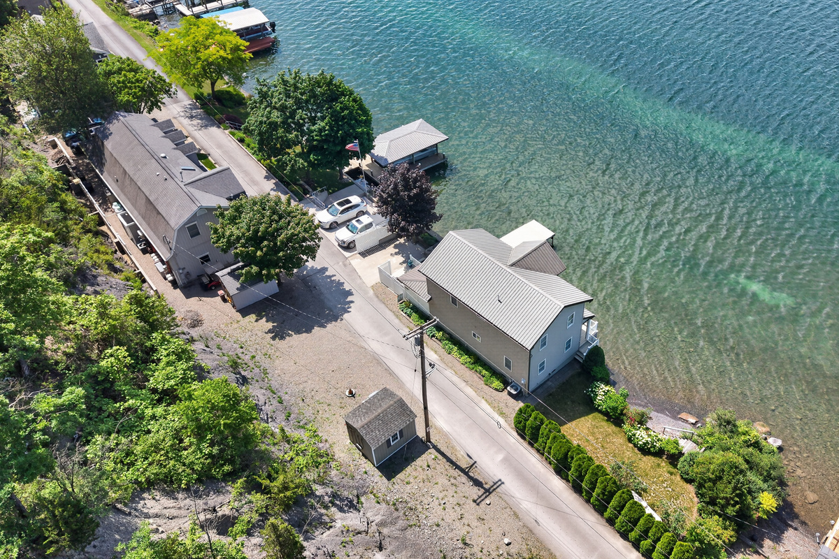 Aerial view across the neighboring waterfront homes
