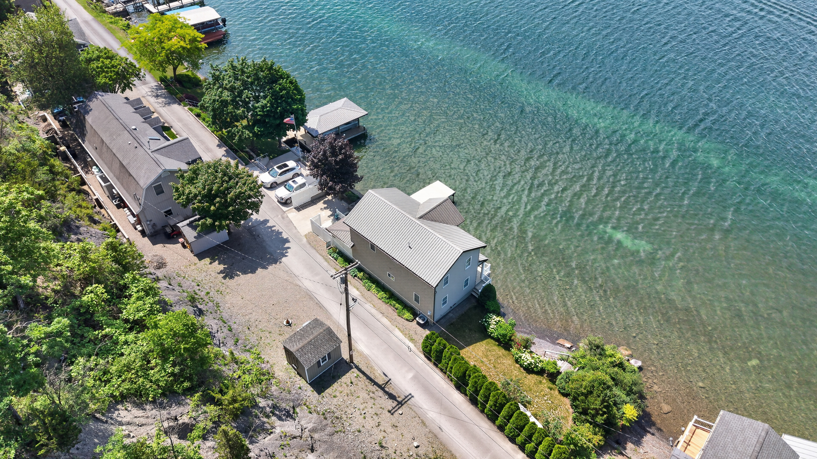 Aerial view across the neighboring waterfront homes
