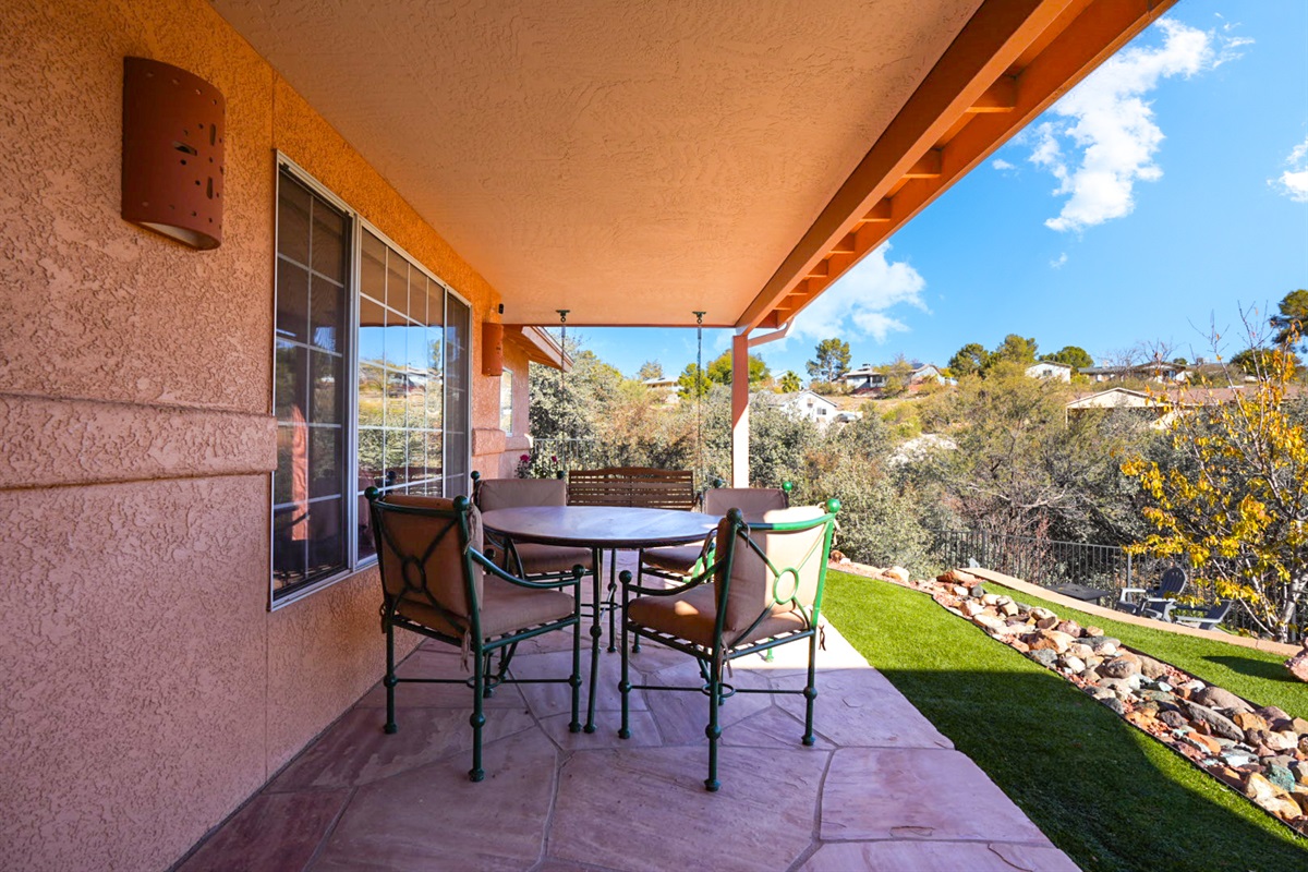 Enjoy meals outdoors under the covered patio—ideal for al fresco dining with peaceful views.