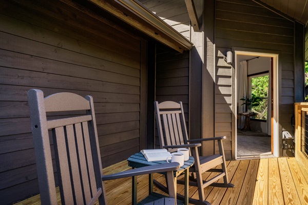 Private outdoor nook with rocking chairs — perfect for quiet moments.