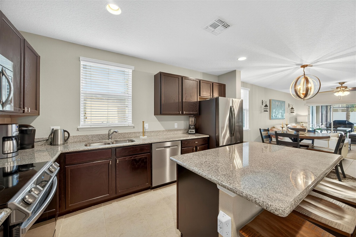 Gourmet kitchen stocked with all essentials — coffee maker, toaster, blender, and more.
