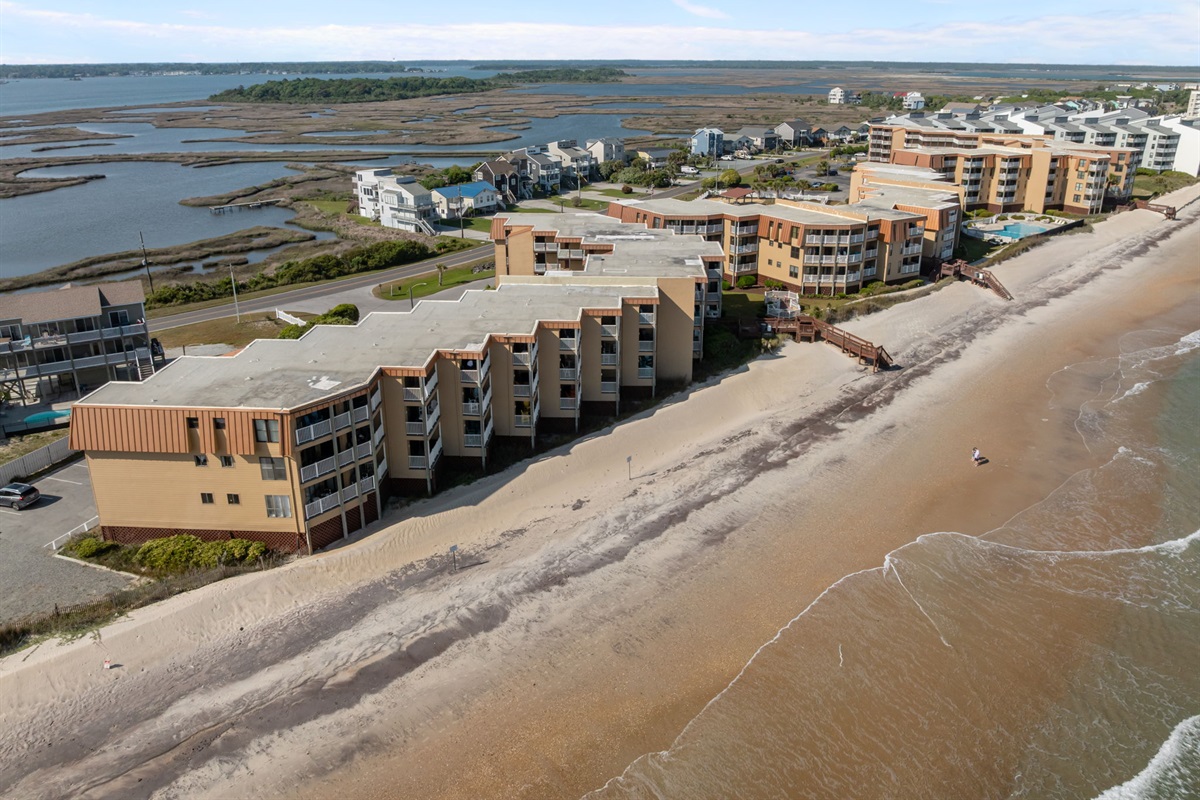 Expansive aerial of Topsail Dunes showcasing its prime oceanfront setting and surrounding coastal landscape