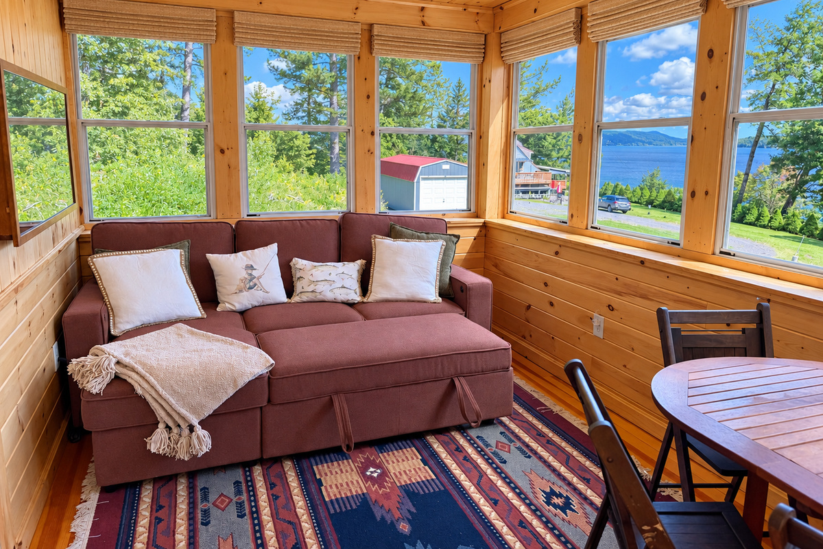 The sofa tuns into a bed providing extra sleeping area on the sun porch.