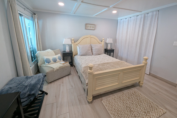 View from the queen guest bedroom bathroom, overlooking the adjustable bed in Dorado, Puerto Rico.