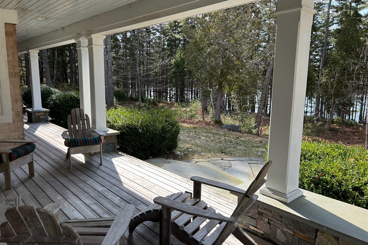 Large front porch with ample seating is a great place to relax.