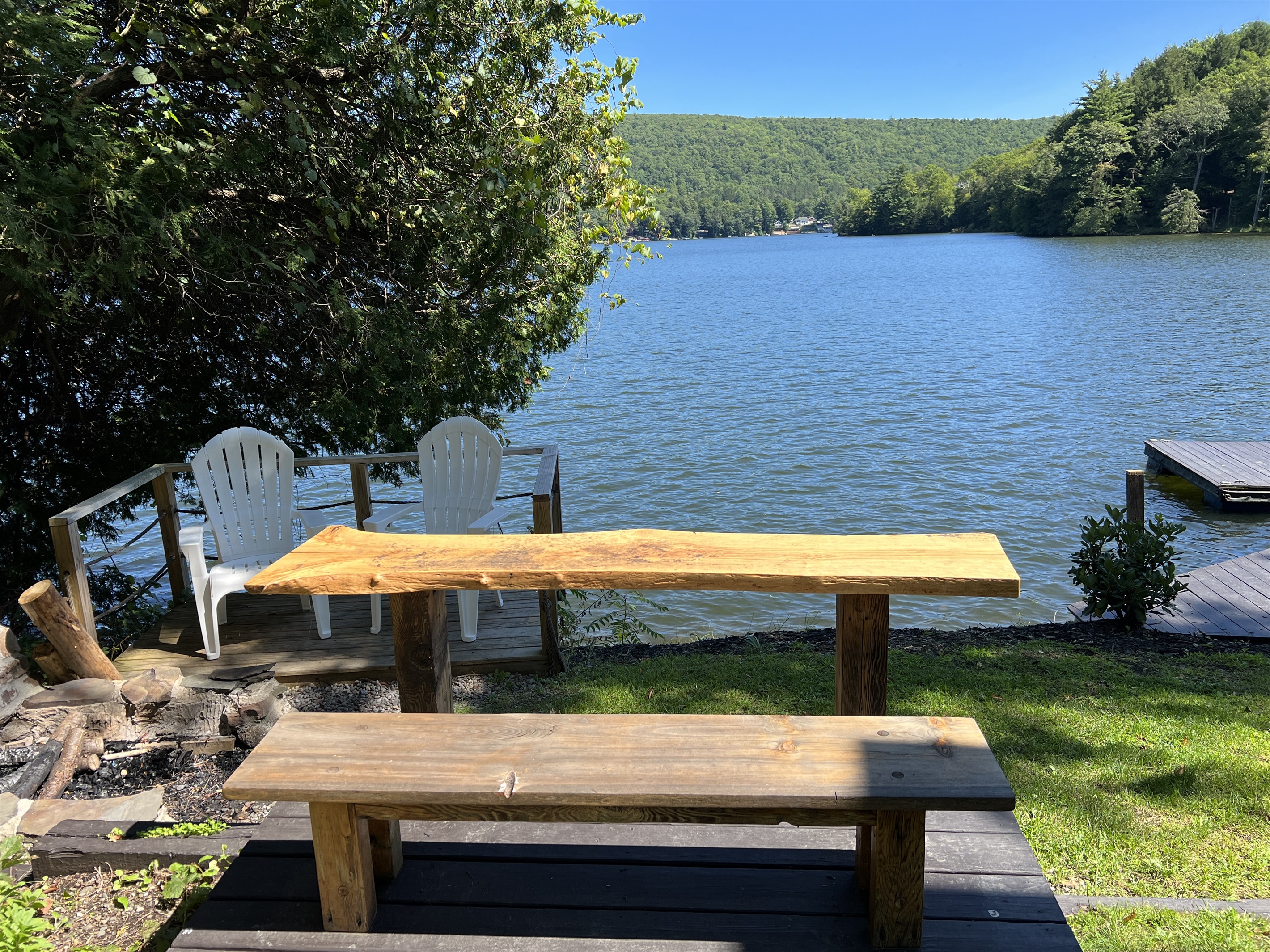 Bar seating by the firepit overlooking the lake.