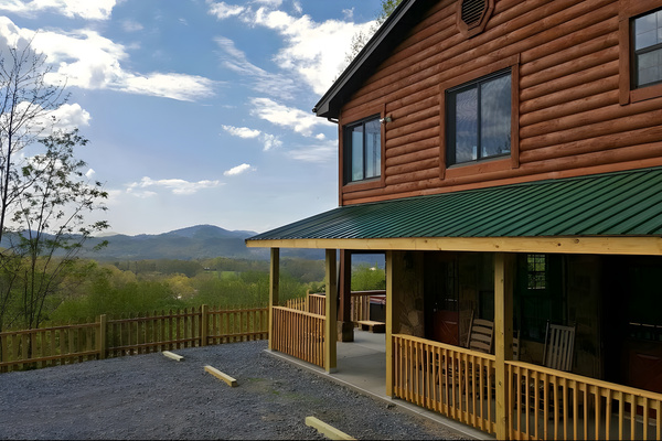 Take in these stunning, sweeping mountain views right from the front porch rocking chairs or the side deck