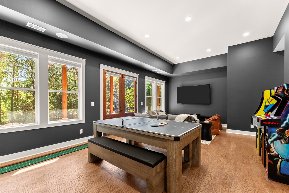 Spacious layout with gaming table and lounge area.