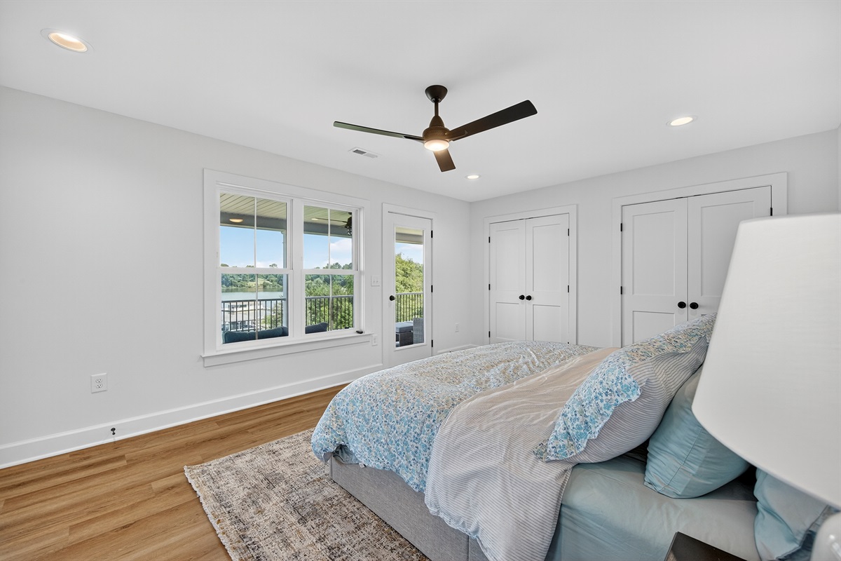 King-size comfort with private balcony access and sweeping lake views.