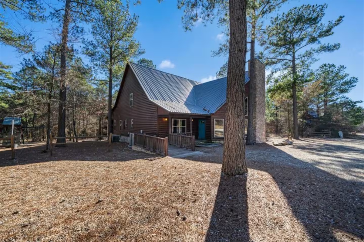 Tucked among the tall pines, this cabin is pure Broken Bow magic