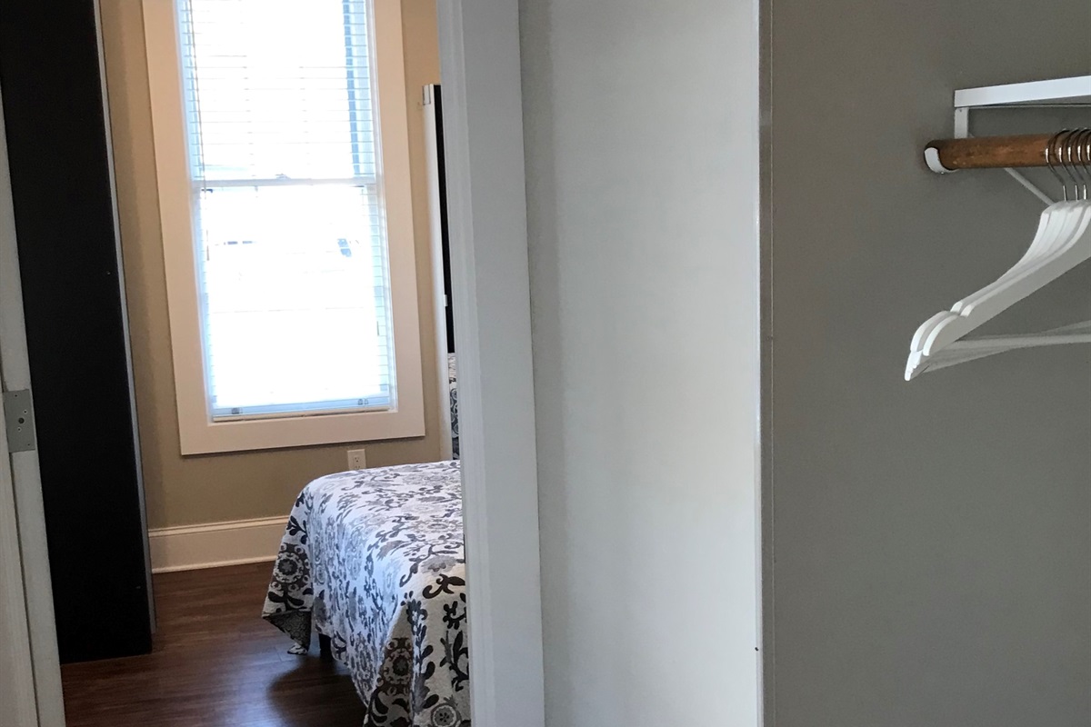 Hall closet leading to bedroom