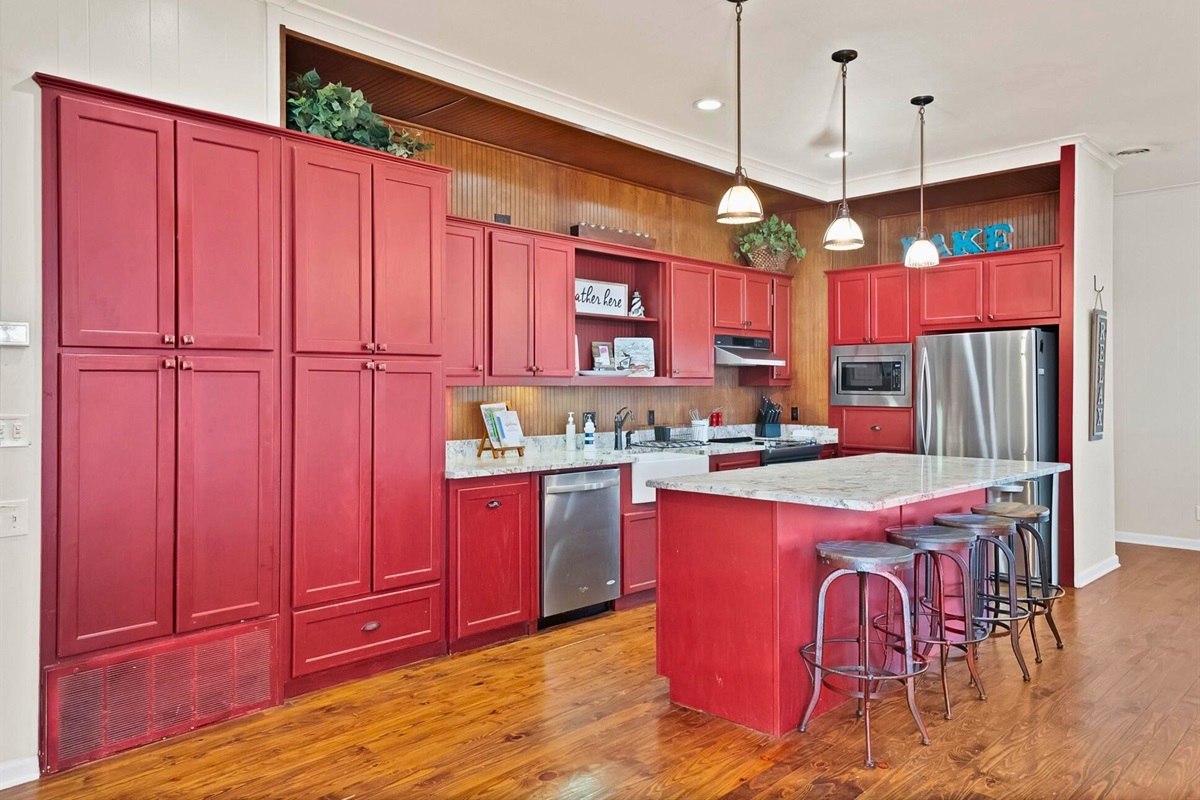 A cheerful kitchen space with bold color and plenty of room for meals and memories.