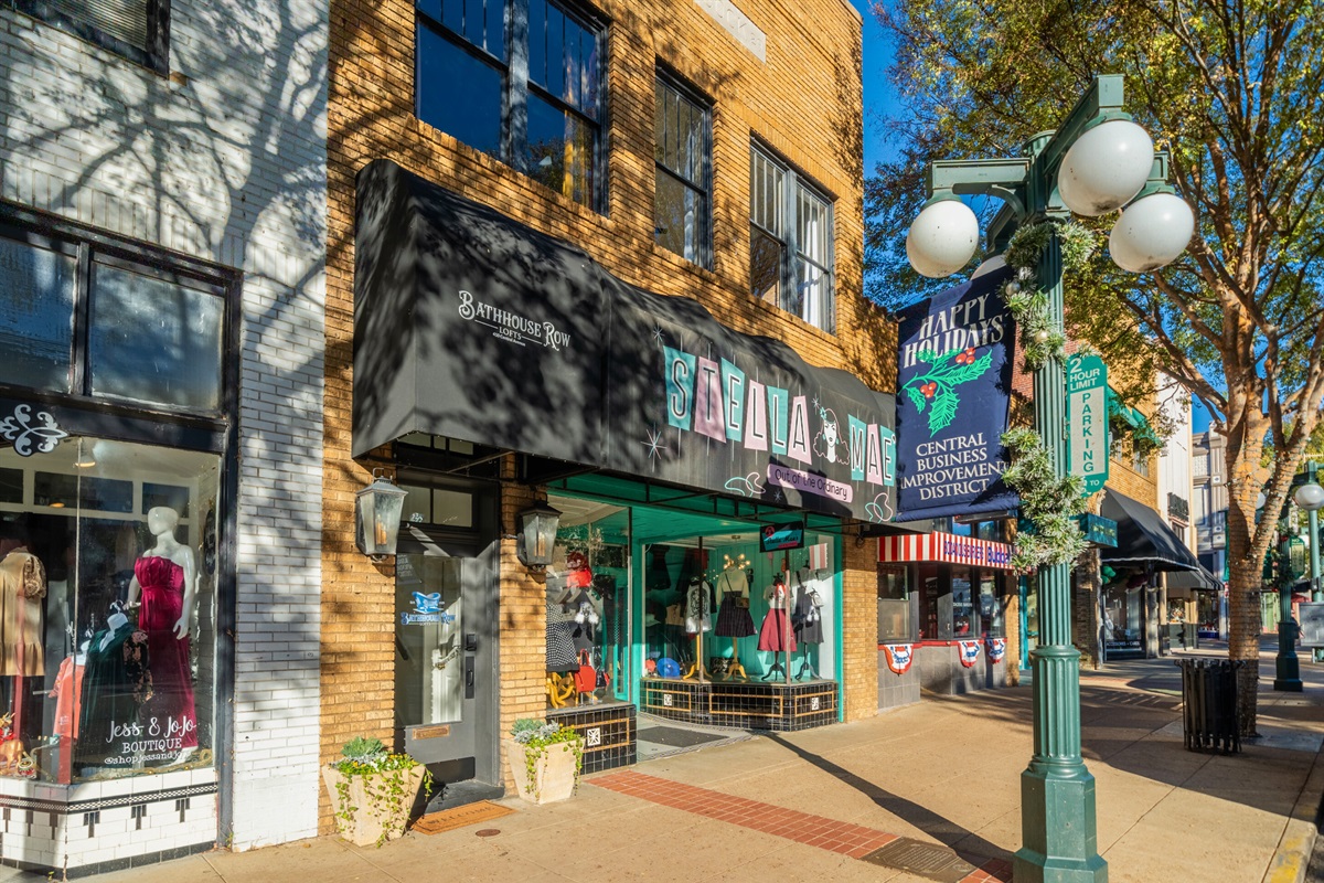 The lively atmosphere of downtown Hot Springs is reflected in its colorful storefronts and welcoming vibe, making it a must-visit spot during your stay.