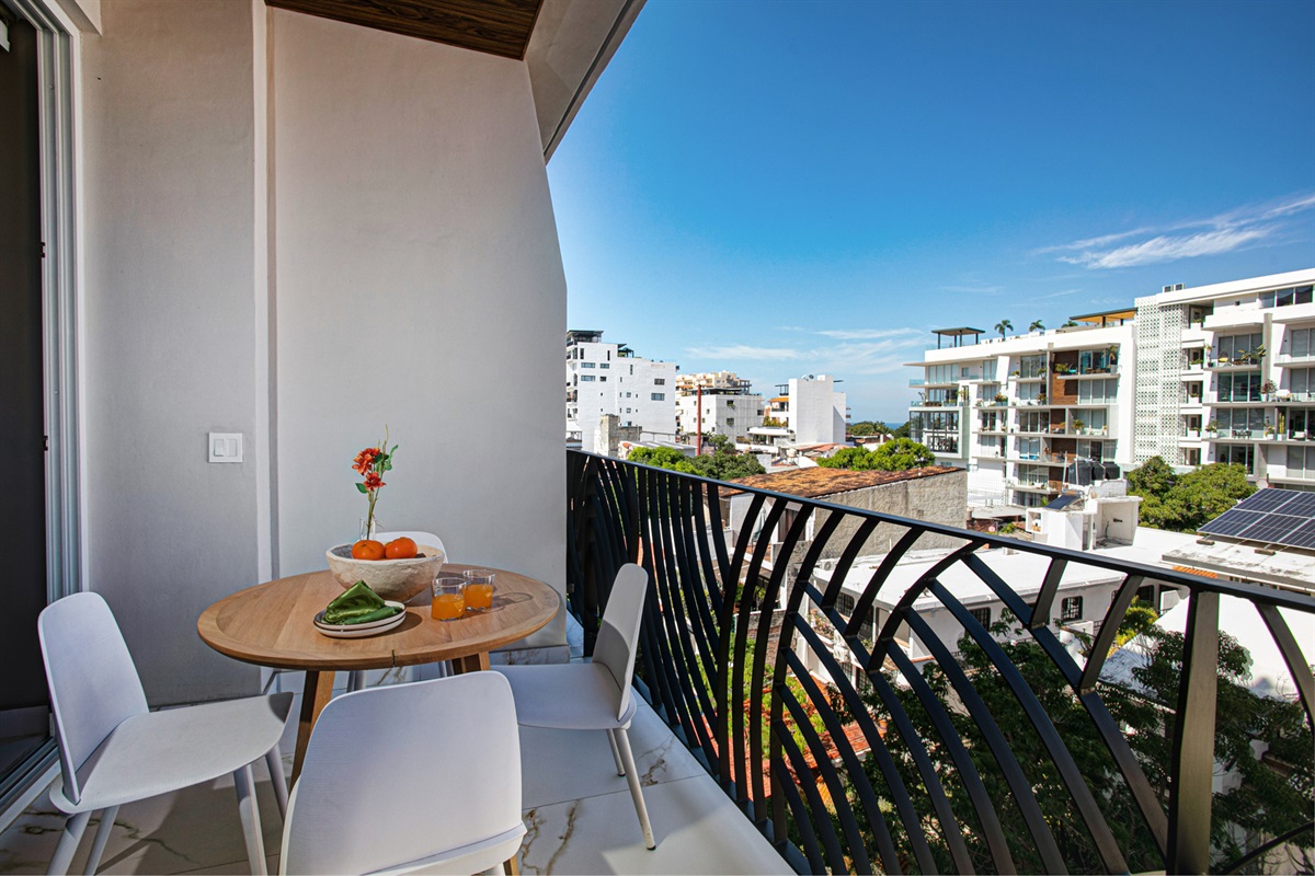 Enjoy peaceful moments on the balcony with vibrant mountain vistas—perfect for a slow morning juice or sunset unwind.