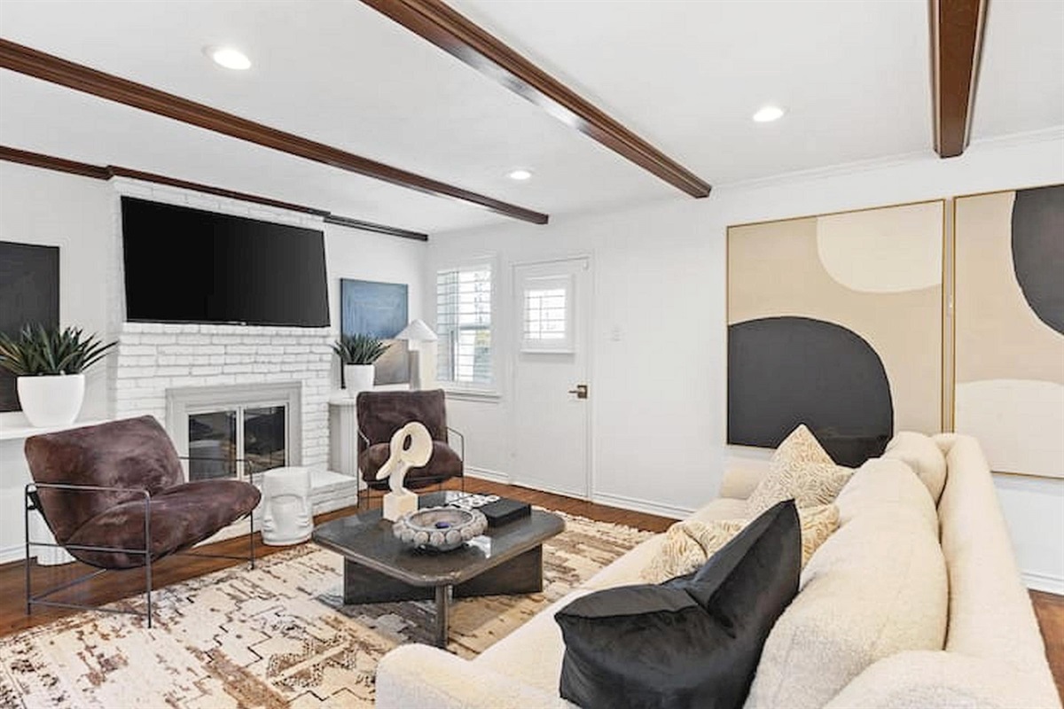 Stylish and inviting living room with comfortable seating, designer touches, and an open layout perfect for relaxing, gathering, or movie nights. ✨🛋️