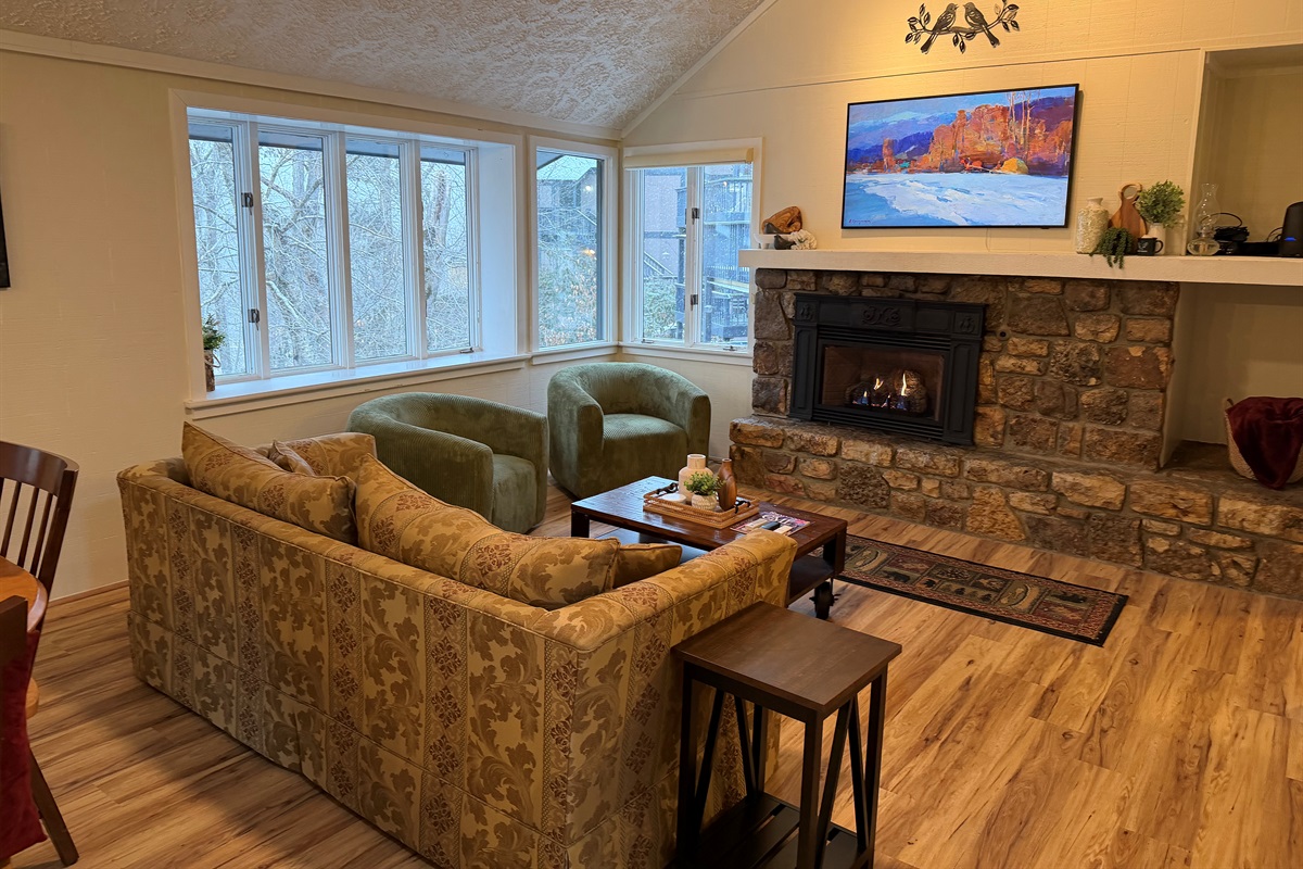 Living Room with Picture frame smart TV, and Gas fireplace