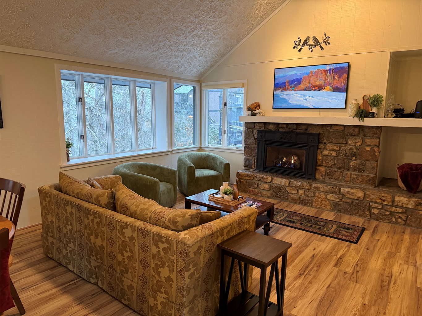 Living Room with Picture frame smart TV, and Gas fireplace