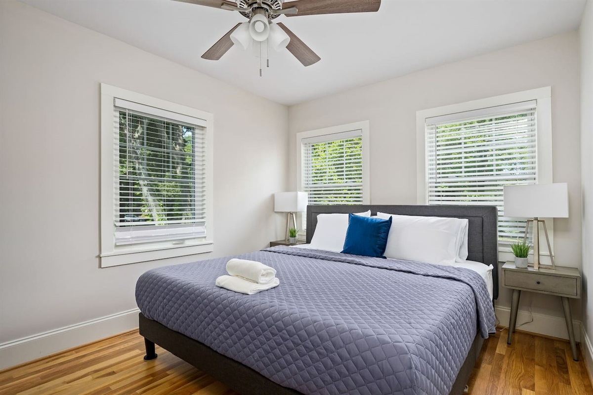 Features a king bed with luxurious bedding and tranquil decor, crafted for a restful night.