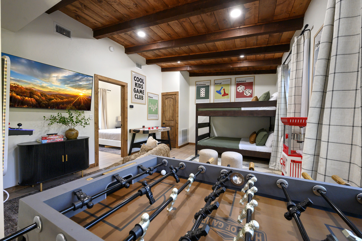 The kids get their own retreat too. A playful bunk and game room with foosball, air hockey, classic games, a popcorn machine and plenty of space for movie nights and friendly competition.
