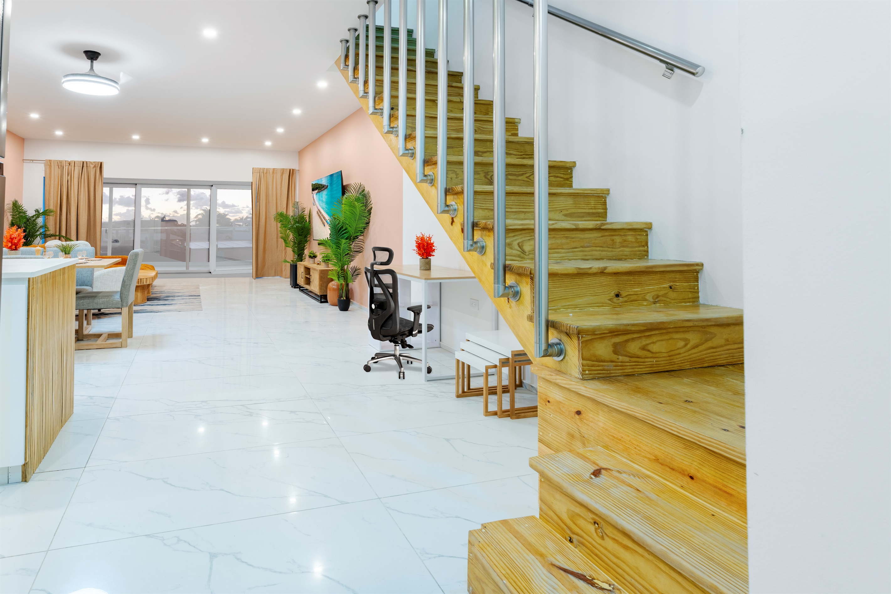 Under-stair area with built-in desk and chair, creating a dedicated workspace nook