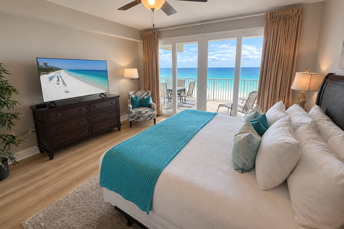 Master bedroom with balcony access and ocean views