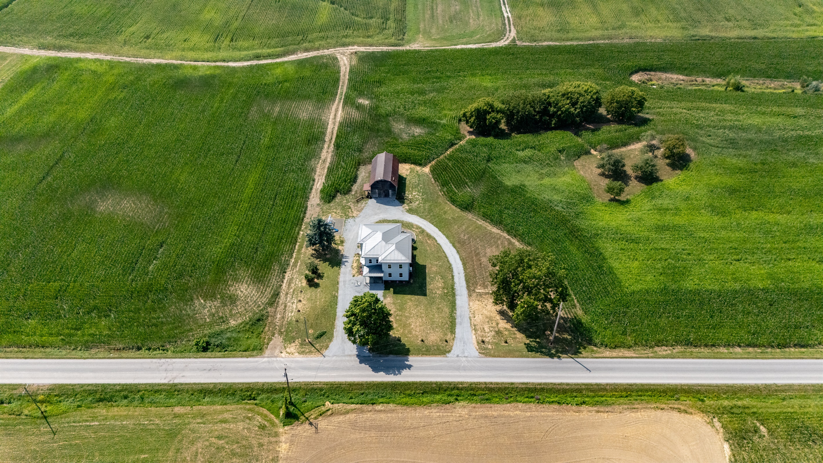 Bird’s-eye view showcasing endless farmland and privacy—ideal for serene country living.