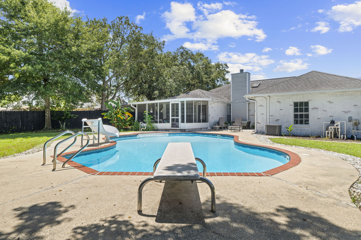 Take the plunge off the diving board in this spacious private pool, just steps from the screened porch.