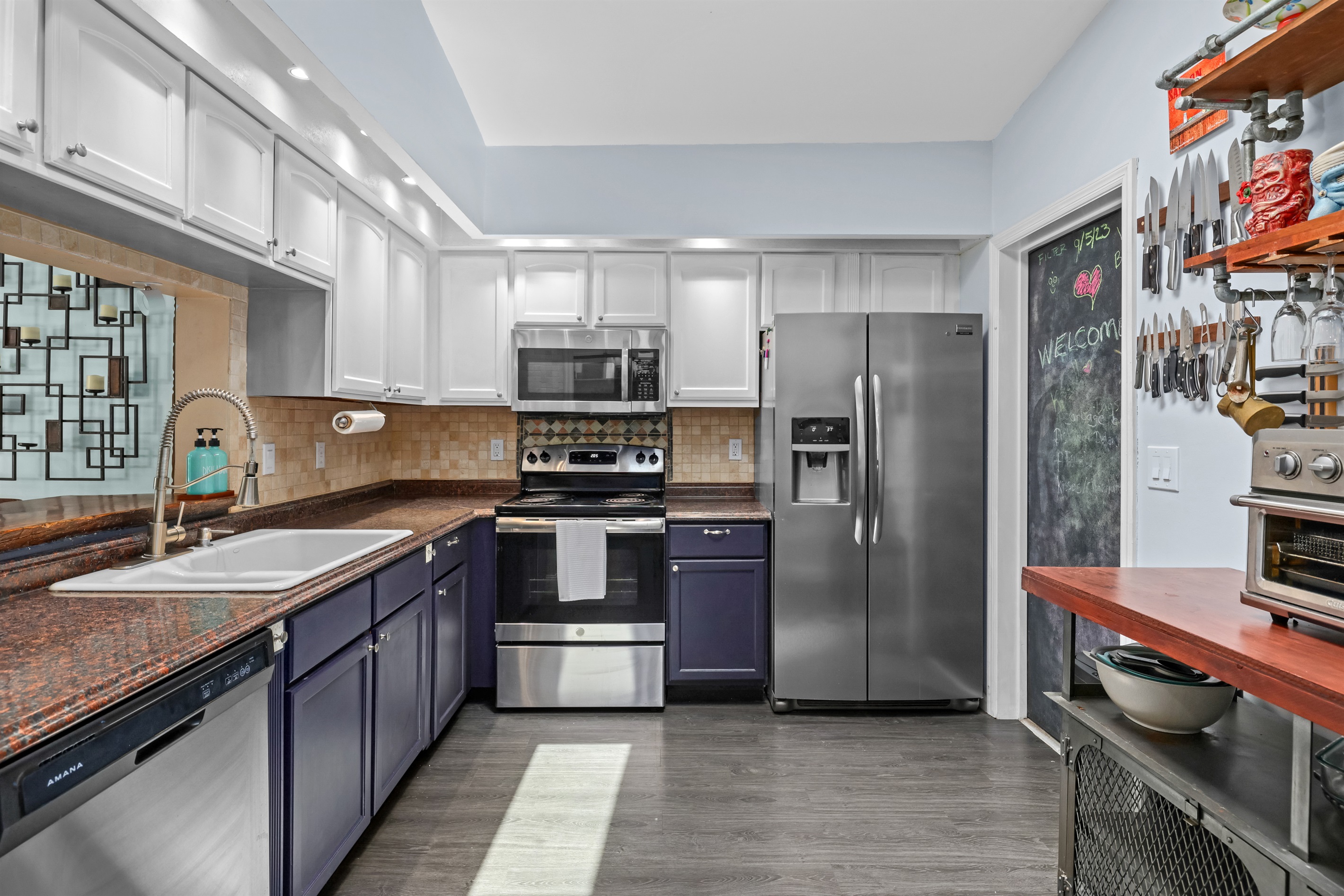 From the hallway, you can see a bright, open kitchen.