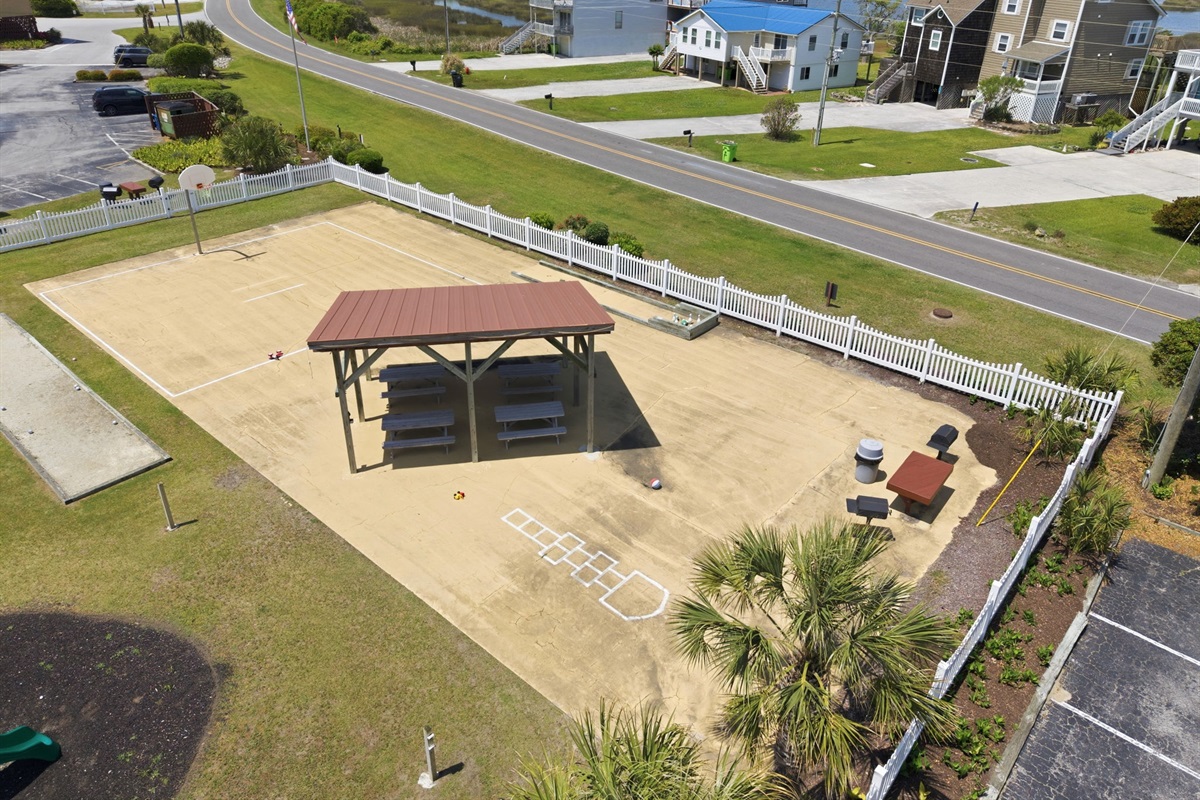 Enjoy basketball, shuffleboard, and open green space during your stay
