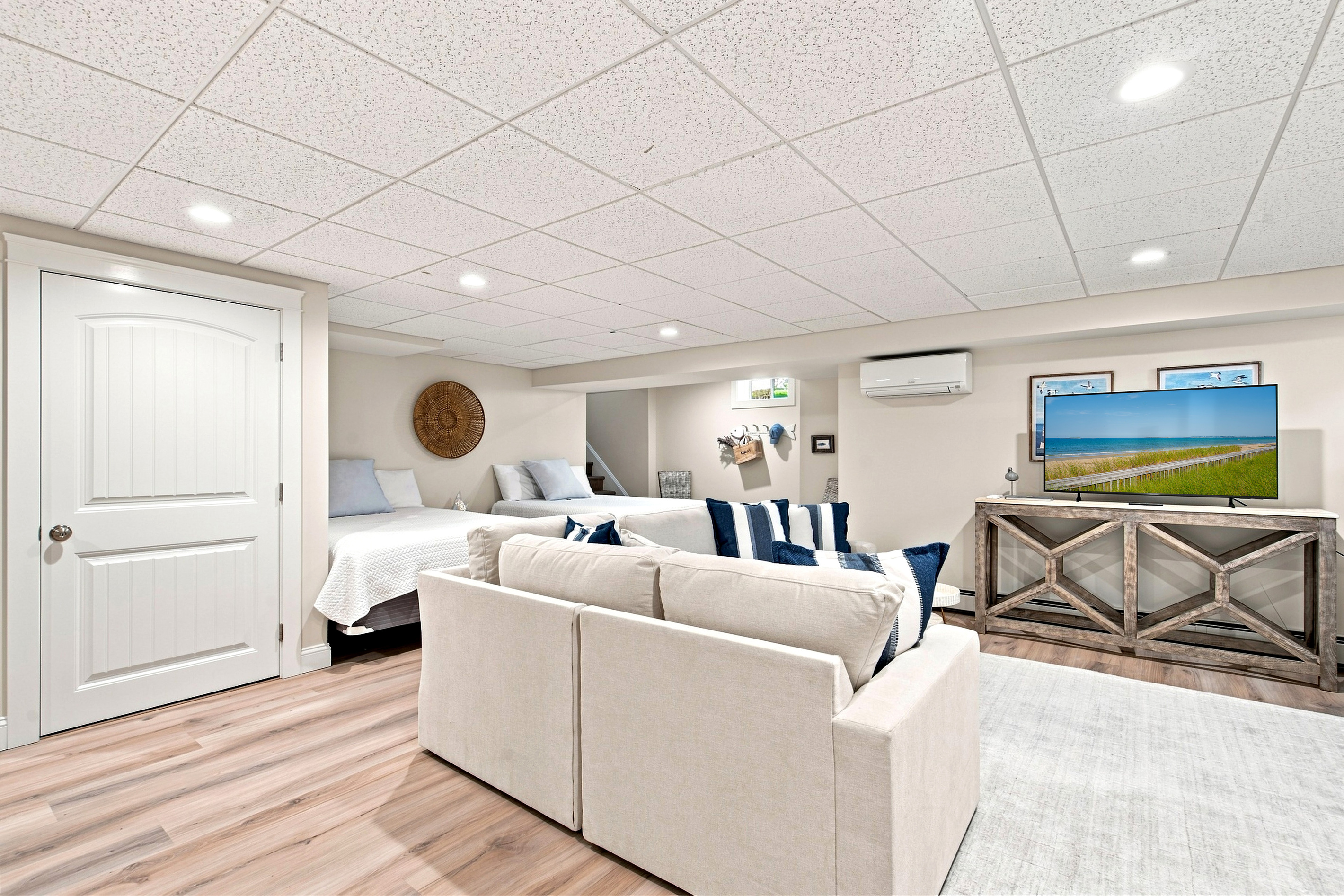Plenty of room to spread out—this second living space is perfect for relaxing together after a day at the beach.