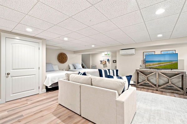 Plenty of room to spread out—this second living space is perfect for relaxing together after a day at the beach.