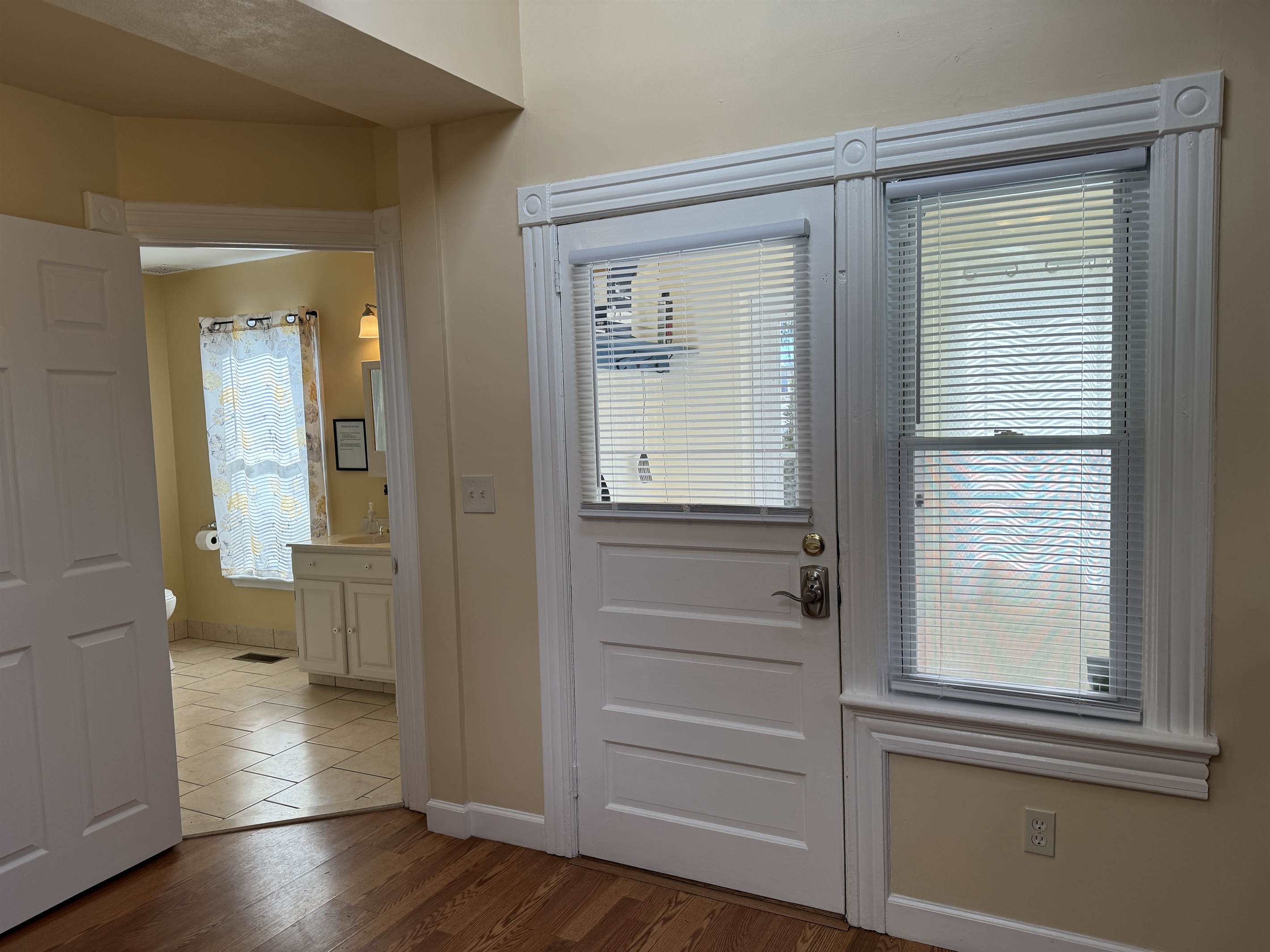 Cooperstown Cottage main entrance and pool access, full bathroom to the left.
