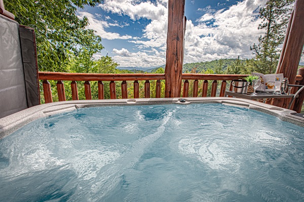 Relax in the hot tub while taking in those mountain views