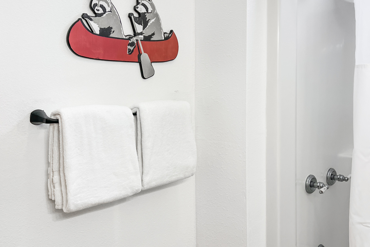 Full bathroom includes a tub and shower combination, convenient for families traveling with children.